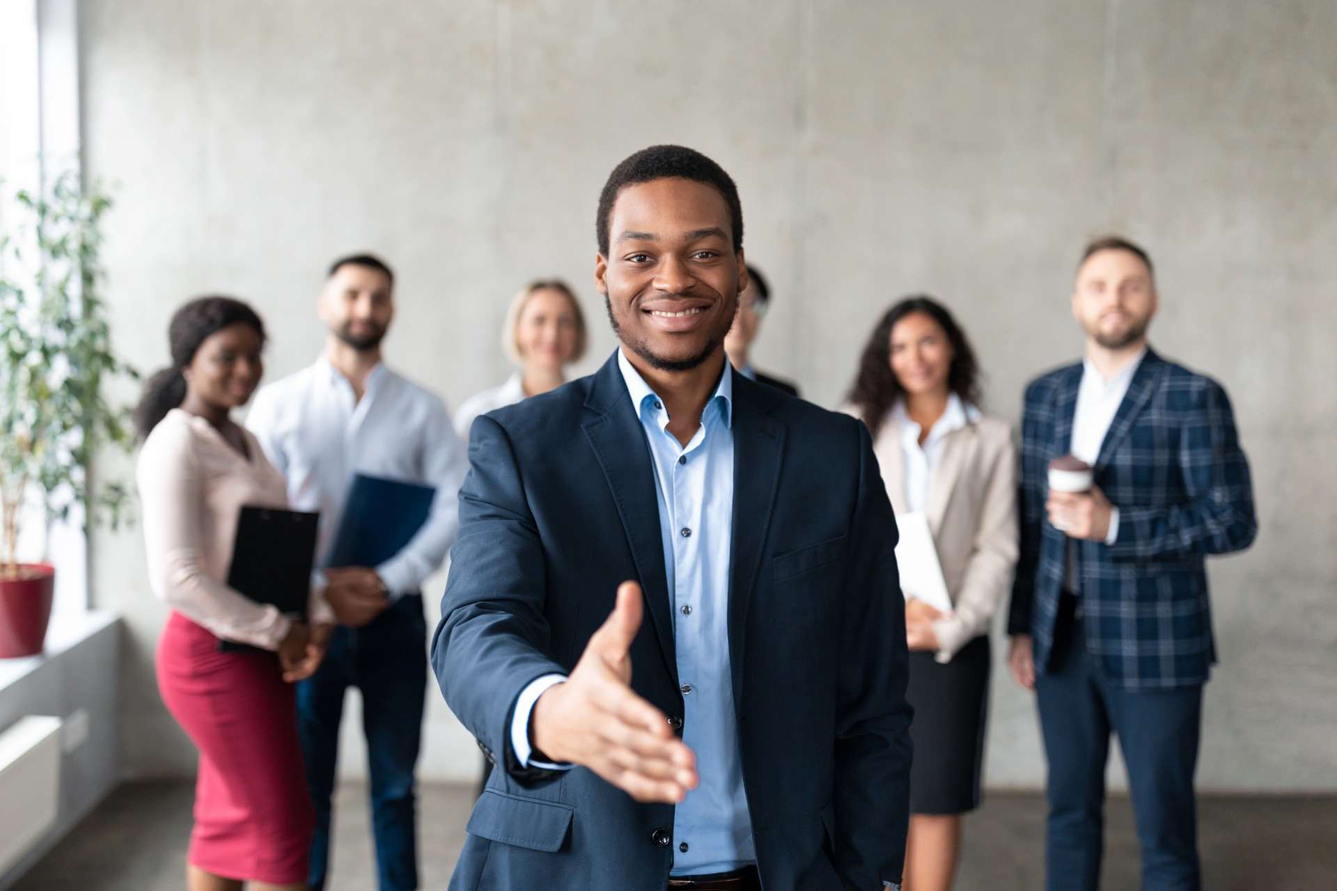 Successful African American Businessman Stretching Hand For Handshake In Office